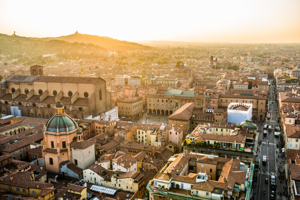 Aerial view of Bologna, Italy at sunset. Colorful sky over the historical city center old buildings